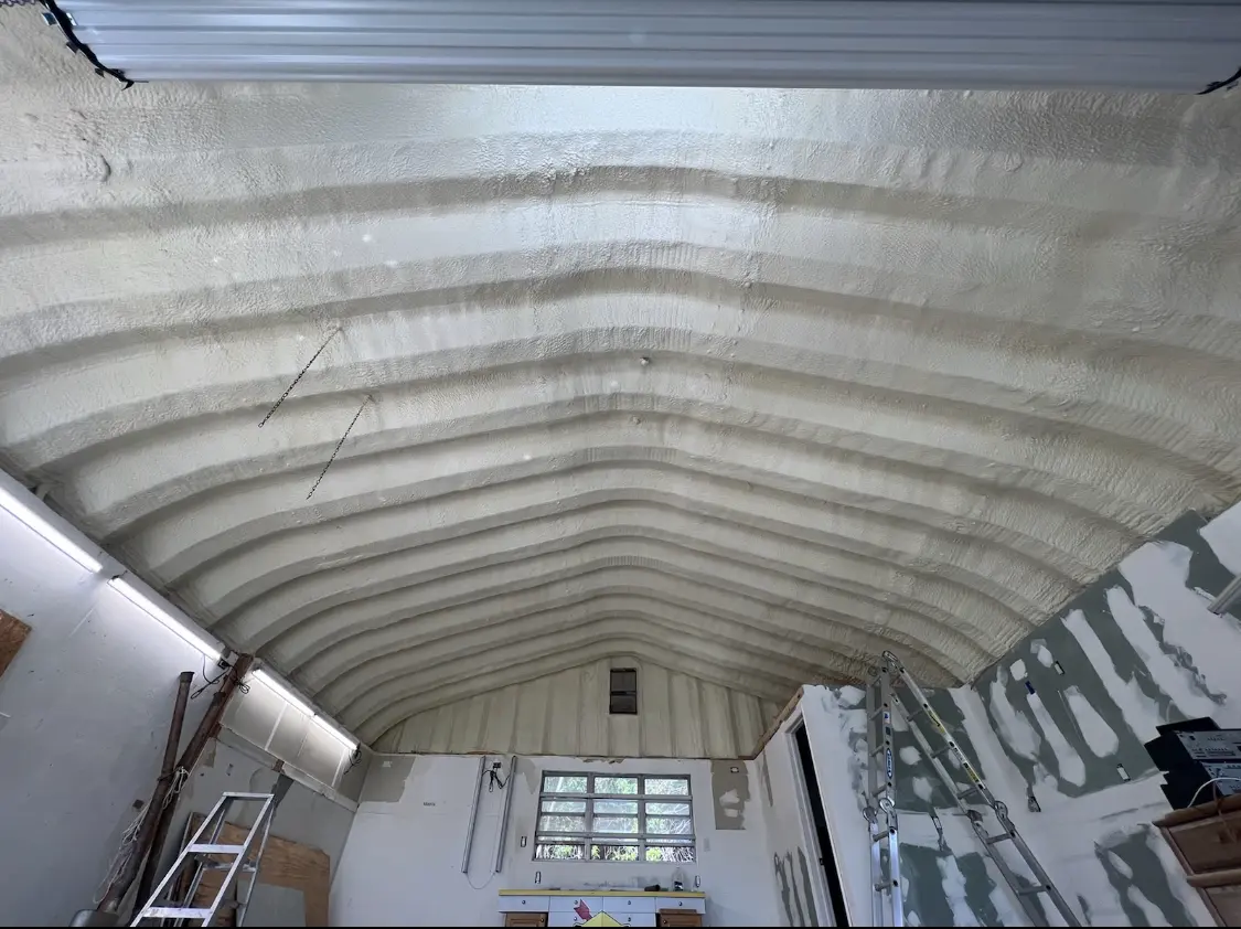 Spray polyurethane foam applied to the underside of a metal roof deck in Chanhassen